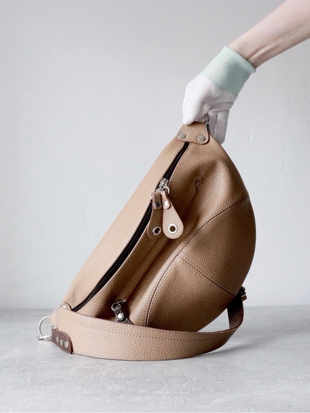 Coocaburra -The Luna Pebbled Leather Crescent Sling Bag in Warm Taupe 13”/8”
